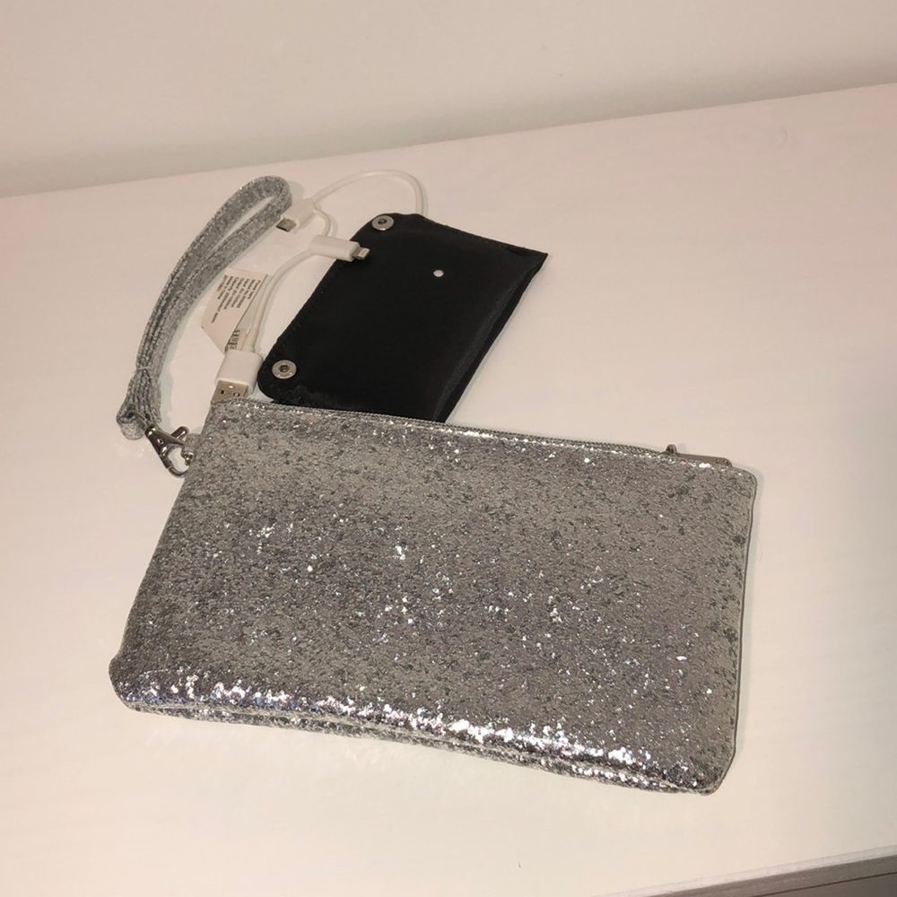 Wristlet clutch with built in charger charger